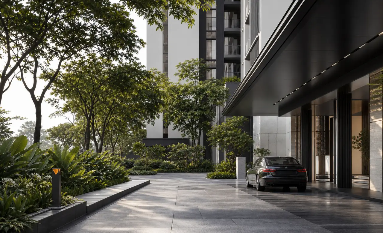 Landscaped residential arrival court beneath a dark entrance canopy